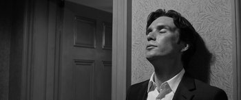 Movie still from “The Party” (2017), directed by Sally Potter – Black and white photograph of a man looking up; Close Up shot, Low angle