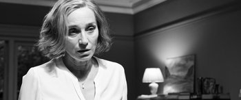 Movie still from “The Party” (2017), directed by Sally Potter – Black and white photograph of a woman in front of a lamp; Close Up shot, Over the shoulder angle