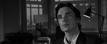 Movie still from “The Party” (2017), directed by Sally Potter – Black and white photograph of a man in a suit; Close Up shot, Low angle