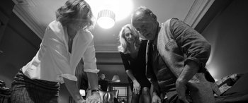 Movie still from “The Party” (2017), directed by Sally Potter – A group of people standing next to each other in a room; Medium shot, Low angle