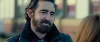 A person with a beard wearing a jacket