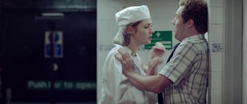 A man and a woman in a kitchen
