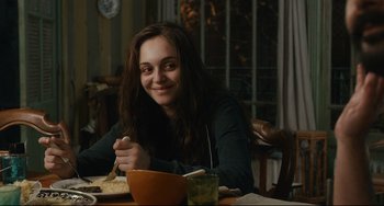 Movie still from “The Past” (2013), directed by Asghar Farhadi – A woman sitting at a table with a plate of food; Medium shot, Over the shoulder angle