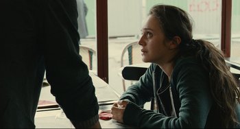 Movie still from “The Past” (2013), directed by Asghar Farhadi – A woman sitting at a table looking at a man; Close Up shot, Over the shoulder angle