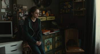 Movie still from “The Past” (2013), directed by Asghar Farhadi – A girl sitting on a chair in a room; Medium shot, Over the shoulder angle
