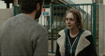Movie still from “The Past” (2013), directed by Asghar Farhadi – A man and a woman standing next to each other outside; Close Up shot, Over the shoulder angle