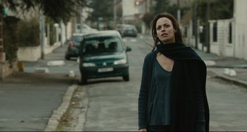 Movie still from “The Past” (2013), directed by Asghar Farhadi – A woman standing on the side of the street; Medium shot, Over the shoulder angle