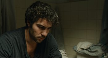 Movie still from “The Past” (2013), directed by Asghar Farhadi – A person sitting in a room; Close Up shot, Over the shoulder angle