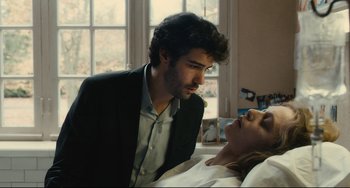 Movie still from “The Past” (2013), directed by Asghar Farhadi – A man and a woman are looking at each other; Medium shot, Over the shoulder angle