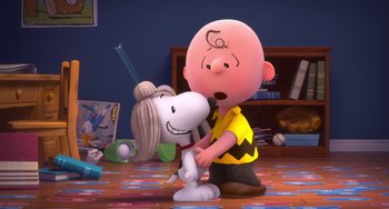 Movie still from “The Peanuts Movie” (2015), directed by Steve Martino – A charlie brown and a snoopy doll in a room; Medium shot, Over the shoulder angle