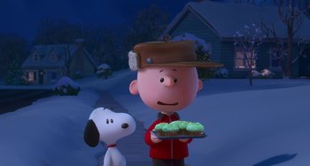 Movie still from “The Peanuts Movie” (2015), directed by Steve Martino – A charlie brown character holding a tray of cupcakes; Medium shot, High angle
