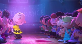 Movie still from “The Peanuts Movie” (2015), directed by Steve Martino – A group of people standing in front of charlie brown; Extreme Wide shot, Low angle
