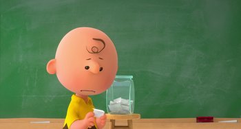 Movie still from “The Peanuts Movie” (2015), directed by Steve Martino – Charlie brown is looking at a jar in front of a chalkboard; Close Up shot, High angle