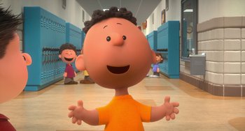 Movie still from “The Peanuts Movie” (2015), directed by Steve Martino – A cartoon of a little boy standing in a school hallway; Medium shot, Low angle