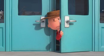 Movie still from “The Peanuts Movie” (2015), directed by Steve Martino – A charlie brown character peeks out of a door; Wide shot, High angle