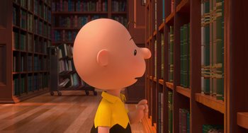 Movie still from “The Peanuts Movie” (2015), directed by Steve Martino – A cartoon of charlie brown looking at a book shelf; Medium shot, Low angle