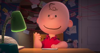 Movie still from “The Peanuts Movie” (2015), directed by Steve Martino – A charlie brown character sitting at a table; Medium shot, High angle