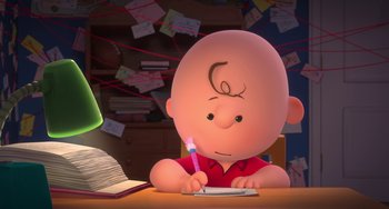 Movie still from “The Peanuts Movie” (2015), directed by Steve Martino – A cartoon character is writing on a piece of paper; Medium shot, High angle
