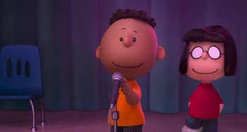 Movie still from “The Peanuts Movie” (2015), directed by Steve Martino – A cartoon of a boy and a girl on a stage with microphones; Medium shot, Over the shoulder angle