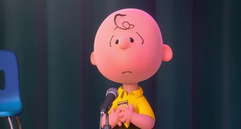 Movie still from “The Peanuts Movie” (2015), directed by Steve Martino – A charlie brown cartoon character is holding a microphone; Close Up shot, High angle