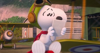 Movie still from “The Peanuts Movie” (2015), directed by Steve Martino – A cartoon of a dog wearing a pilot's hat and goggles; Medium shot, High angle