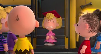 Movie still from “The Peanuts Movie” (2015), directed by Steve Martino – A charlie brown statue sitting in front of a staircase; Medium shot, Over the shoulder angle