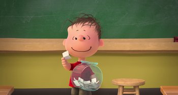 Movie still from “The Peanuts Movie” (2015), directed by Steve Martino – A charlie brown cartoon character holding a jar of paper; Medium shot, High angle