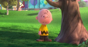 Movie still from “The Peanuts Movie” (2015), directed by Steve Martino – A charlie brown character standing next to a tree; Wide shot, High angle