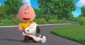 Movie still from “The Peanuts Movie” (2015), directed by Steve Martino – A charlie brown and snoopy character on the street; Wide shot, Low angle