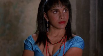Movie still from “The People Under the Stairs” (1991), directed by Wes Craven – A person wearing a blue dress; Close Up shot, High angle