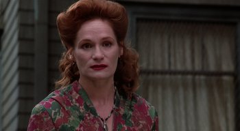 Movie still from “The People Under the Stairs” (1991), directed by Wes Craven – A person wearing a floral shirt; Close Up shot, Low angle