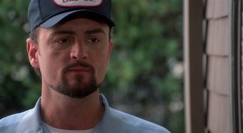 Movie still from “The People Under the Stairs” (1991), directed by Wes Craven – A person wearing a hat; Close Up shot, Low angle
