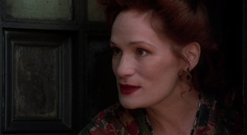 Movie still from “The People Under the Stairs” (1991), directed by Wes Craven – A person with red hair; Close Up shot, Over the shoulder angle