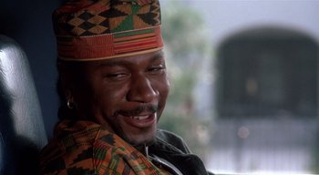Movie still from “The People Under the Stairs” (1991), directed by Wes Craven – A person wearing a hat; Close Up shot, Low angle