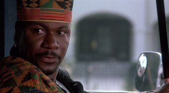 Movie still from “The People Under the Stairs” (1991), directed by Wes Craven – A person wearing a hat; Close Up shot, Low angle