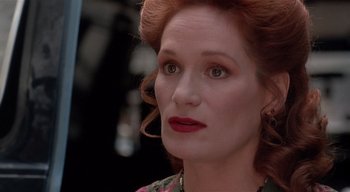 Movie still from “The People Under the Stairs” (1991), directed by Wes Craven – A person with red hair; Close Up shot, Over the shoulder angle