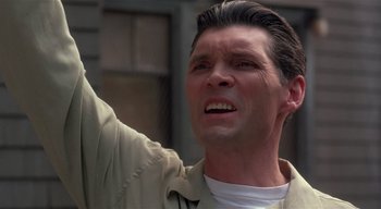 Movie still from “The People Under the Stairs” (1991), directed by Wes Craven – A person with a hand up; Close Up shot, Low angle