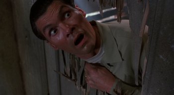 Movie still from “The People Under the Stairs” (1991), directed by Wes Craven – A person looking surprised; Close Up shot, Low angle