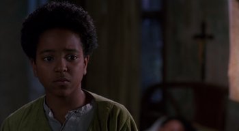 Movie still from “The People Under the Stairs” (1991), directed by Wes Craven – A young man in a green jacket looking at the camera; Close Up shot, Low angle