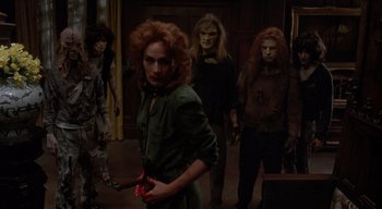 Movie still from “The People Under the Stairs” (1991), directed by Wes Craven – A group of people dressed up as vampires; Medium shot, High angle