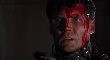 Movie still from “The People Under the Stairs” (1991), directed by Wes Craven – A person with blood on his face; Close Up shot, Low angle
