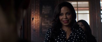 Movie still from “The Perfect Guy” (2015), directed by David M. Rosenthal – A woman in a black and white polka dot shirt; Close Up shot, Over the shoulder angle