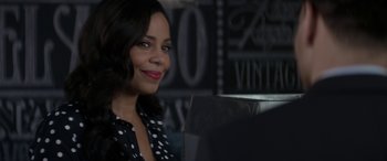 Movie still from “The Perfect Guy” (2015), directed by David M. Rosenthal – A woman in a black and white polka dot shirt smiling; Close Up shot, Over the shoulder angle