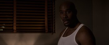 Movie still from “The Perfect Guy” (2015), directed by David M. Rosenthal – A person wearing a tank top; Close Up shot, Over the shoulder angle