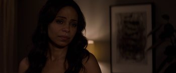 Movie still from “The Perfect Guy” (2015), directed by David M. Rosenthal – A person sitting in a room near a lamp; Close Up shot, Over the shoulder angle