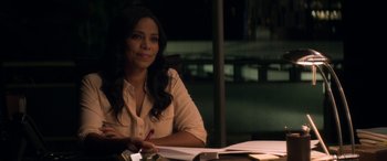 Movie still from “The Perfect Guy” (2015), directed by David M. Rosenthal – A woman sitting at a table with papers and a pen; Close Up shot, Over the shoulder angle