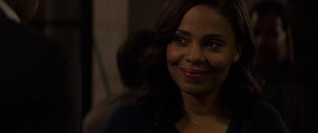 Movie still from “The Perfect Guy” (2015), directed by David M. Rosenthal – A person smiling for the camera; Close Up shot, Over the shoulder angle