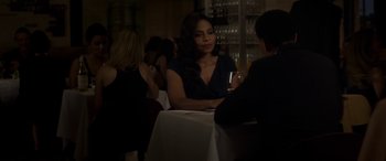 Movie still from “The Perfect Guy” (2015), directed by David M. Rosenthal – A woman sitting at a table with a glass of wine; Medium shot, Over the shoulder angle