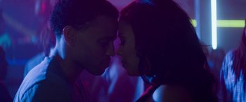 Movie still from “The Perfect Guy” (2015), directed by David M. Rosenthal – A man and a woman kissing in a purple room; Close Up shot, Over the shoulder angle