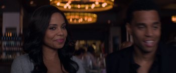 Movie still from “The Perfect Guy” (2015), directed by David M. Rosenthal – A woman standing next to a man in a restaurant; Close Up shot, Over the shoulder angle
